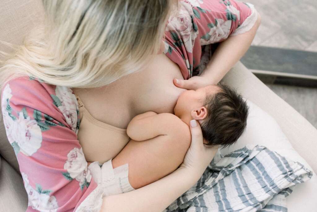 demonstration of cross cradle nursing position 